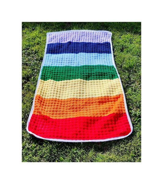 Handmade rainbow crochet blanket, striped with white edging. Chakra colours 