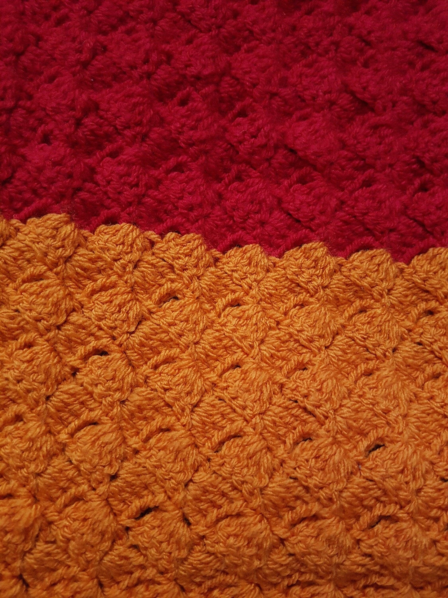 Handmade rainbow crochet blanket, striped with white edging. Chakra colours. Shown close up to illustrate stitch detail
