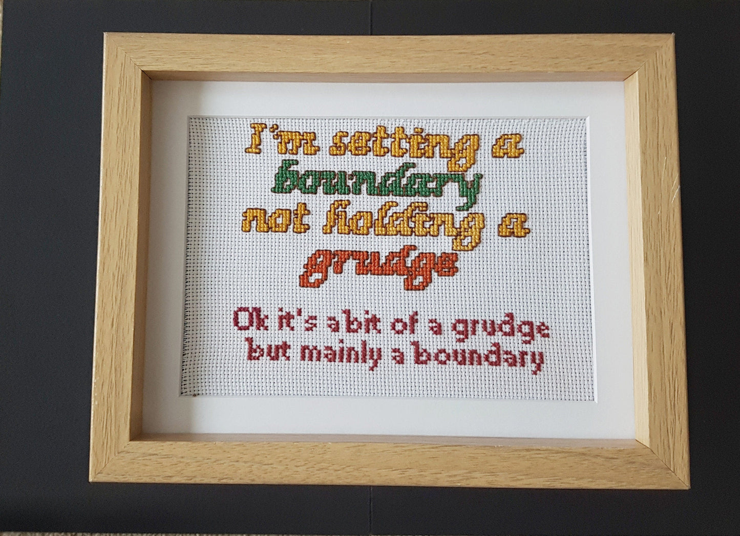 Setting a boundary not holding a grudge, completed cross stitch quote - Thistleflat Crafts