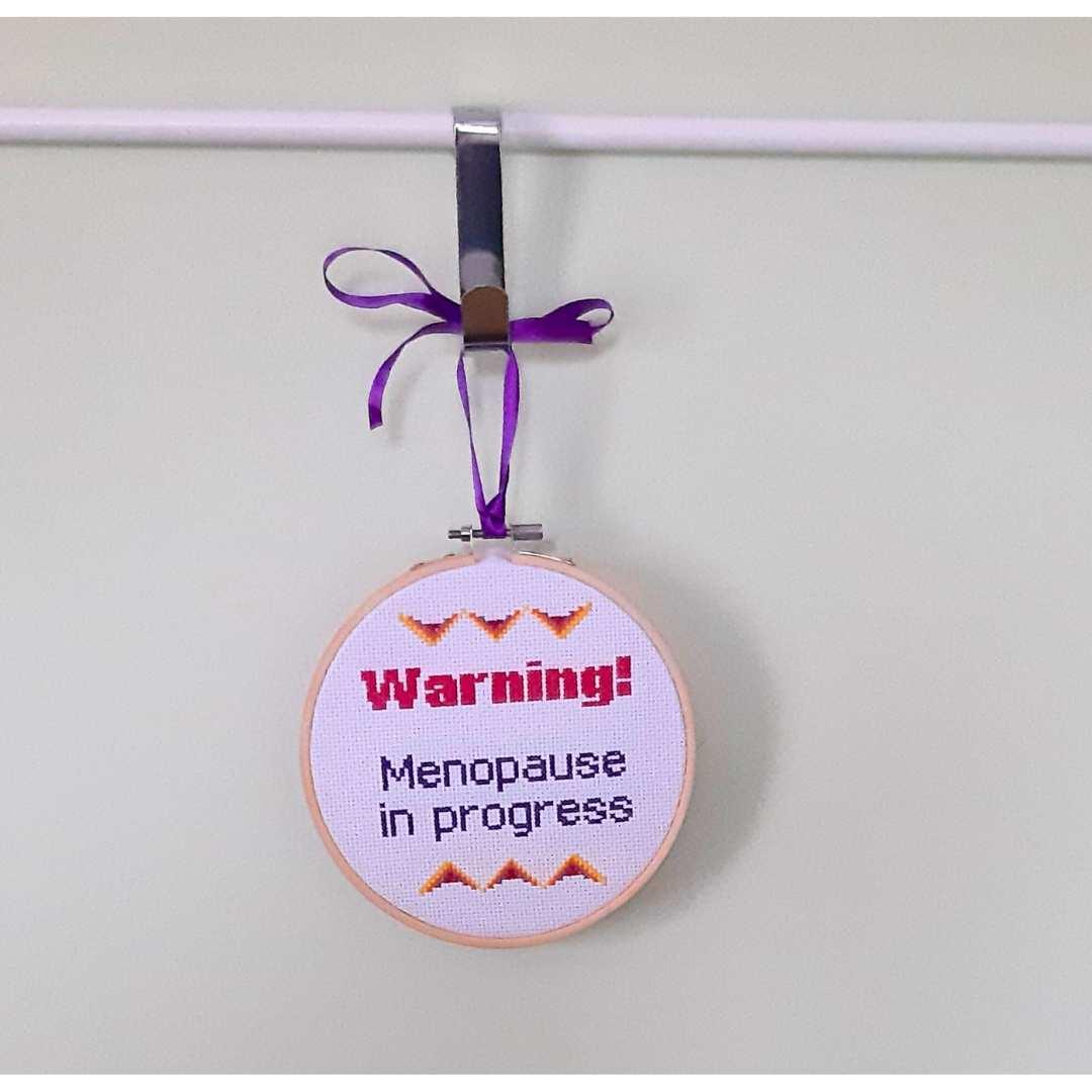 Warning! Menopause in progress, completed cross stitch quote - Thistleflat Crafts