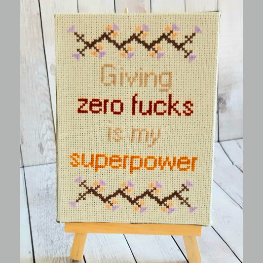 Giving zero fucks is my superpower, completed cross stitch quote - Thistleflat Crafts